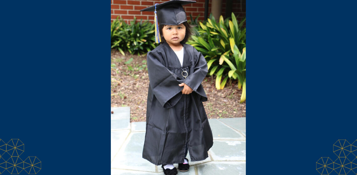 Student's daughter wearing cap and gown at UC Berkeley graduation